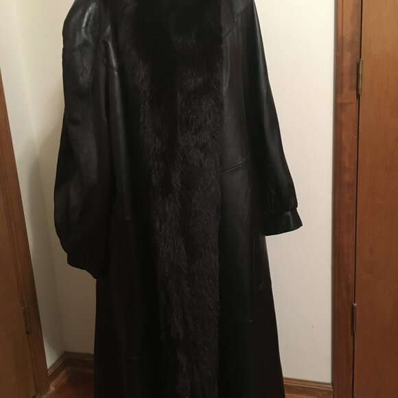 Ladies long leather coat trimmed in fox fur
